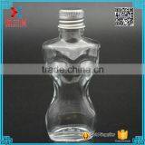 Fancy Design Woman Body Shaped Clear Lotion Glass Bottle With Aluminum Cap thumbnail-1