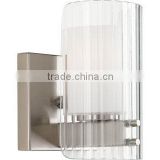 Bathroom Light / Wall Sconce with ribbed clear glass diffuser encompasses individual etched glass shades