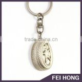 Custom promotional tire design keychain with engraved text