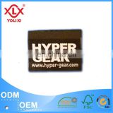 Self adhesive woven label for fashion garment