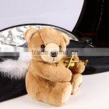 brown angel bear with violin