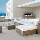 Sectional Sofa With White Cushion and Long Table