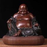The Antique fat buddha statue buddha shown smiling with big belly
