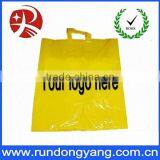 large yellow plastic handle bag with customer logo