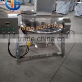 Tilting jacketed kettle for cooking sauce