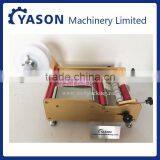 YS-L100 Manual Round Bottle Labeling Machine thumbnail-1
