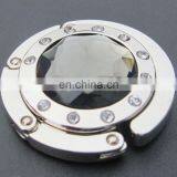 Promotional Wholesale Fashion Table Top Foldable Purse Bag Hanger /Bag Holder /Bag Hook Round Rhinestone Hook