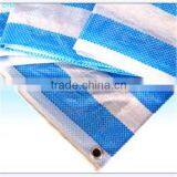 Blue and white striped reflective tarpaulin with aluminum grommets