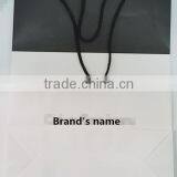 FDT Customized White and Black Wood-free Paper Varnishing Logo Printed Shopping Paper Bag for Cloth