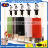 Glass oil vinegar bottle with metal sleeve press pourer 5 colors