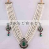 Indian manufactured pearl gemstone fashion necklace set. Party wear and wedding jewelry. Brass metal