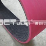 Rubber ribbed belt coated with rubber