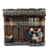 rustic style one old couple sitting on the door with happy figure for souvenirsaries
