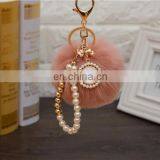 2021 Год Оптовая продажа индивидуально изготовленных роскошных ключей с шерстяными шариками, перловыми ключницами, ключницами с пупырышками и ленточными бантиками для женских сумок. Высокое качество. thumbnail-6