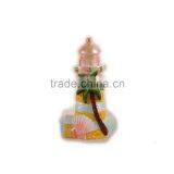 Candlestick With Coconut Tree and Shell on Lighthouse Statue thumbnail-2