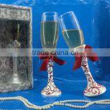 with red ribbon resin decorative champagne toasting flutes