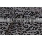 The grey dots interlock print polyester elastane crepe fabric