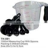 plastic measuring cup with spoons