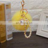 2021 Год Оптовая продажа индивидуально изготовленных роскошных ключей с шерстяными шариками, перловыми ключницами, ключницами с пупырышками и ленточными бантиками для женских сумок. Высокое качество. thumbnail-4