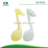 lovely cute musical note plastic food grade tea accessory.