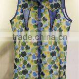 Women's sleeveless two-tone tops with colourful polka dots