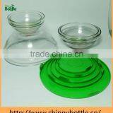 clear glass serving bowls with green lids