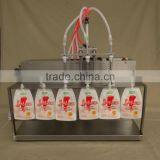 Hot Sale 3 Nozzles Liquid Spout Bag Filling Machine For Milk Juice thumbnail-1