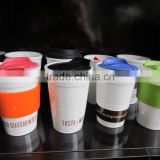 single wall ceramic travel mug with silicone lid and sleeve