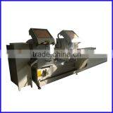 Double head mitre cutting saw for aluminium profile window design