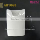 White ceramic hanging humidifier with metal "S" hook
