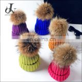 Hot China Supplier Knitted Kids Caps with Raccoon Fur Pompoms Christmas Hats