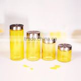 hot sale 4pcs yellow glass storage bottle with metal lid