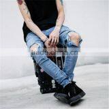Slightly Faded Blue Jeans With Zip Down Whiskering Ripped Pants thumbnail-1