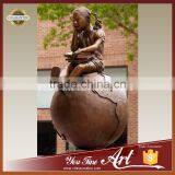 Casting Bronze Girl Sitting Globe Sculpture For School thumbnail-1