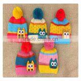 hot sale striated colorful winter knitted hat with owl decoration for kids ,with ball top
