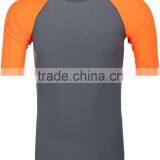 92% Polyester 8% Spandex (Lycra) Short Sleeves Grey Compression Shirt / Rash Guard With Neon Orange Sleeves