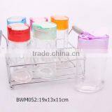 6pcs Oval Glass Spice Jar Set With Coloful Plastic Lid in a Metal Rack