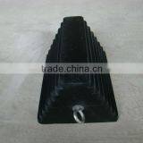 Molded rubber chock block for truck