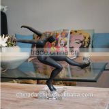 Interesting shape of kick ball sculpture in black                        
                                                Quality Choice