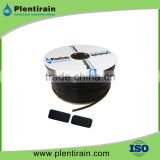 Pressure compensated flat emitter drip tape for drip irrigation