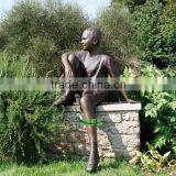 Bronze Boy Sculpture Sitting in Forest thumbnail-1