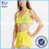 Yihao New listing ! Wholesale custom Built-in bra crop top/pleated tennis mini skirt cheerleader costum sport outfit