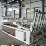 Automatic corrugated paperboard stacking machine
