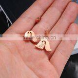 Express In Spanish Stainless Steel Rose Gold Dog Earrings thumbnail-3