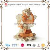 Polyresin Smiling Sitting Angel Figurine thumbnail-1