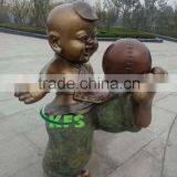 Bronze Boy Playing Football Sculpture