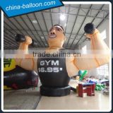 Big inflatable man lifting weights, pvc inflatable muscle man for gyms advertising