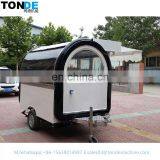 A Mobile Food Trailer Capable of Producing Hot Dogs and Barbecues.