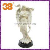 Beautiful white angel with wings stone sculptures