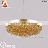 Ola pendant lamp with gold shade and orange crystal